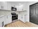 Updated kitchen featuring stainless appliances, white cabinets, and countertops at 4684 72 N Ave, Pinellas Park, FL 33781