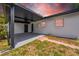 A covered patio features an outdoor area and updated landscaping at 4684 72 N Ave, Pinellas Park, FL 33781