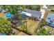 Aerial view of backyard featuring a large yard and a pool with a fence at 4915 Chariton Ave, Tampa, FL 33603