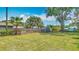 Home with fenced in backyard, lush lawn and mature trees at 4915 Chariton Ave, Tampa, FL 33603