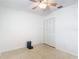 Clean bedroom with neutral carpet and a louvered door closet at 4915 Chariton Ave, Tampa, FL 33603