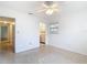Bright bedroom featuring a ceiling fan and access to an ensuite laundry room at 4915 Chariton Ave, Tampa, FL 33603