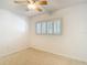Bedroom with neutral carpet and plantation shutters at 4915 Chariton Ave, Tampa, FL 33603