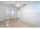 Light-filled bedroom includes mirrored closet doors and neutral floors at 4915 Chariton Ave, Tampa, FL 33603