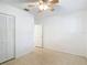 Light-filled bedroom features a ceiling fan and closet at 4915 Chariton Ave, Tampa, FL 33603