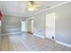 Cozy den with tiled floors, ceiling fan, and a door leading to the exterior at 4915 Chariton Ave, Tampa, FL 33603