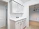 Hallway featuring built in storage leading into a view of the dining and bedrooms at 4915 Chariton Ave, Tampa, FL 33603