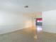 Bright, spacious living area with neutral walls, retro floors, and recessed lighting at 4915 Chariton Ave, Tampa, FL 33603