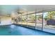 Enclosed screened-in patio with great views of the backyard, shed, and landscaping at 4915 Chariton Ave, Tampa, FL 33603