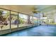 Enjoy backyard views from this spacious screened patio with ceiling fans and outdoor access to the beautifully landscaped yard at 4915 Chariton Ave, Tampa, FL 33603