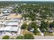 Aerial view of a residential neighborhood, with lush green trees, houses, and street access at 5106 15Th S Ave, Gulfport, FL 33707