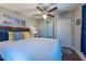 Well-lit bedroom with ceiling fan, closet and warm, inviting decor at 5106 15Th S Ave, Gulfport, FL 33707