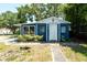 Charming blue home with a well-maintained lawn and inviting front entrance at 5106 15Th S Ave, Gulfport, FL 33707