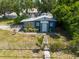 Charming blue home featuring a well-manicured lawn and inviting front entrance at 5106 15Th S Ave, Gulfport, FL 33707