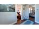 Hallway view with doorway views into bedrooms, showing hardwood flooring and neutral paint at 5106 15Th S Ave, Gulfport, FL 33707