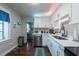 Bright kitchen featuring white cabinets, stainless steel appliances, and stylish countertops at 5106 15Th S Ave, Gulfport, FL 33707
