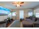 Cozy living room with hardwood floors, flat screen TV, comfortable seating, and bright natural light at 5106 15Th S Ave, Gulfport, FL 33707