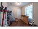 The room features hard wood floors, one window, a closet, and is full of personal items at 5106 15Th S Ave, Gulfport, FL 33707