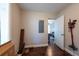 This room features hardwood flooring, gray walls, one window, and has an open doorway at 5106 15Th S Ave, Gulfport, FL 33707