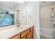 Bathroom with vanity, mirror, and a shower-tub combo at 5115 Stonehaven Ct, Tampa, FL 33624