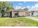 Charming single-story home featuring a well-maintained lawn and attached garage at 5115 Stonehaven Ct, Tampa, FL 33624