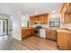 Bright kitchen featuring wood cabinets, stainless steel appliances, and granite countertops at 5115 Stonehaven Ct, Tampa, FL 33624