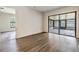Bright living room with sliding glass doors and wood-look flooring at 5115 Stonehaven Ct, Tampa, FL 33624