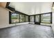 Enclosed sunroom with multiple windows showcasing outdoor scenery at 5115 Stonehaven Ct, Tampa, FL 33624