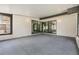 Enclosed sunroom featuring block walls, ample natural light, and a concrete floor at 5115 Stonehaven Ct, Tampa, FL 33624
