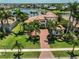 Aerial view of grand property, manicured landscaping, and red brick drive at 5417 Tybee Island Dr, Apollo Beach, FL 33572