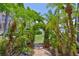 Manicured backyard garden leading to waterfront view at 5417 Tybee Island Dr, Apollo Beach, FL 33572