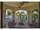 Balcony with tile floors, a table set for four, and a scenic view of the waterfront at 5417 Tybee Island Dr, Apollo Beach, FL 33572