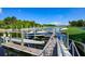 Private boat dock featuring multiple boat lifts, providing convenient water access and picturesque views at 5417 Tybee Island Dr, Apollo Beach, FL 33572