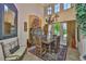 Inviting dining room featuring a rustic table and chairs set under a decorative chandelier with high ceilings at 5417 Tybee Island Dr, Apollo Beach, FL 33572