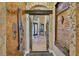 Elegant entryway featuring ornate ironwork, decorative wall art, and tile flooring, creating a grand entrance at 5417 Tybee Island Dr, Apollo Beach, FL 33572