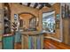 Home wet bar featuring a uniquely designed counter, wine storage, and views of the outdoor pool area at 5417 Tybee Island Dr, Apollo Beach, FL 33572