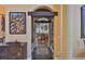 Hallway featuring decorative ironwork, architectural details, and a view into the adjacent living area at 5417 Tybee Island Dr, Apollo Beach, FL 33572