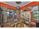Bright hobby room featuring a large wooden table, custom shelves, and colorful décor with sliding glass doors at 5417 Tybee Island Dr, Apollo Beach, FL 33572