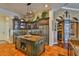 Kitchen showcasing custom cabinetry, stainless steel appliances, tile backsplash, and large center island at 5417 Tybee Island Dr, Apollo Beach, FL 33572