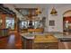 Kitchen with island seating and stainless steel sink opens to the living area with beautiful backyard views at 5417 Tybee Island Dr, Apollo Beach, FL 33572