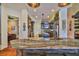 Open concept kitchen featuring island, wood cabinets, stainless appliances, and adjacent dining area at 5417 Tybee Island Dr, Apollo Beach, FL 33572