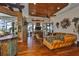 Comfortable living room with wood floors, a decorative ceiling, a full bar, and views of the pool at 5417 Tybee Island Dr, Apollo Beach, FL 33572