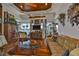 Living room boasting a wood beamed ceiling, large windows and doors, and comfortable seating at 5417 Tybee Island Dr, Apollo Beach, FL 33572