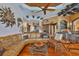 Spacious living room with hardwood floors, stylish decor, and seamless access to the kitchen and bar area at 5417 Tybee Island Dr, Apollo Beach, FL 33572