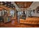 Comfortable living room with wood floors, a decorative ceiling, a full bar, and views of the pool at 5417 Tybee Island Dr, Apollo Beach, FL 33572