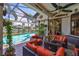 The screened patio features a swimming pool, spa, seating, and views of the intercoastal waterway at 5417 Tybee Island Dr, Apollo Beach, FL 33572