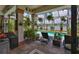 The screened patio is decorated with many plants, lounge chairs and a view of the intercoastal waterway at 5417 Tybee Island Dr, Apollo Beach, FL 33572