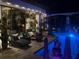 The screened pool area is lighted at night and features lounge chairs and a view of the swimming pool at 5417 Tybee Island Dr, Apollo Beach, FL 33572