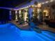 Outdoor pool area with lounge chairs, potted plants, and string lights at 5417 Tybee Island Dr, Apollo Beach, FL 33572