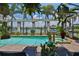 The screened pool area has an inground spa, swimming pool, decorative plants, and a relaxing view of the intercoastal waterway at 5417 Tybee Island Dr, Apollo Beach, FL 33572
